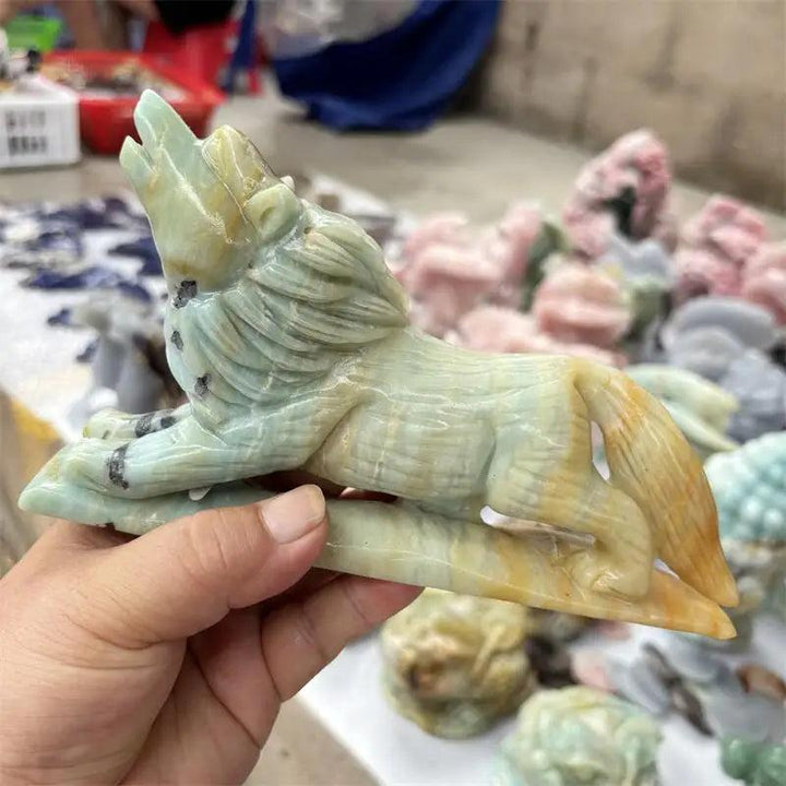 Polished natural Amazonite wolf carving in green and brown, a healing crystal animal figurine for home decor.