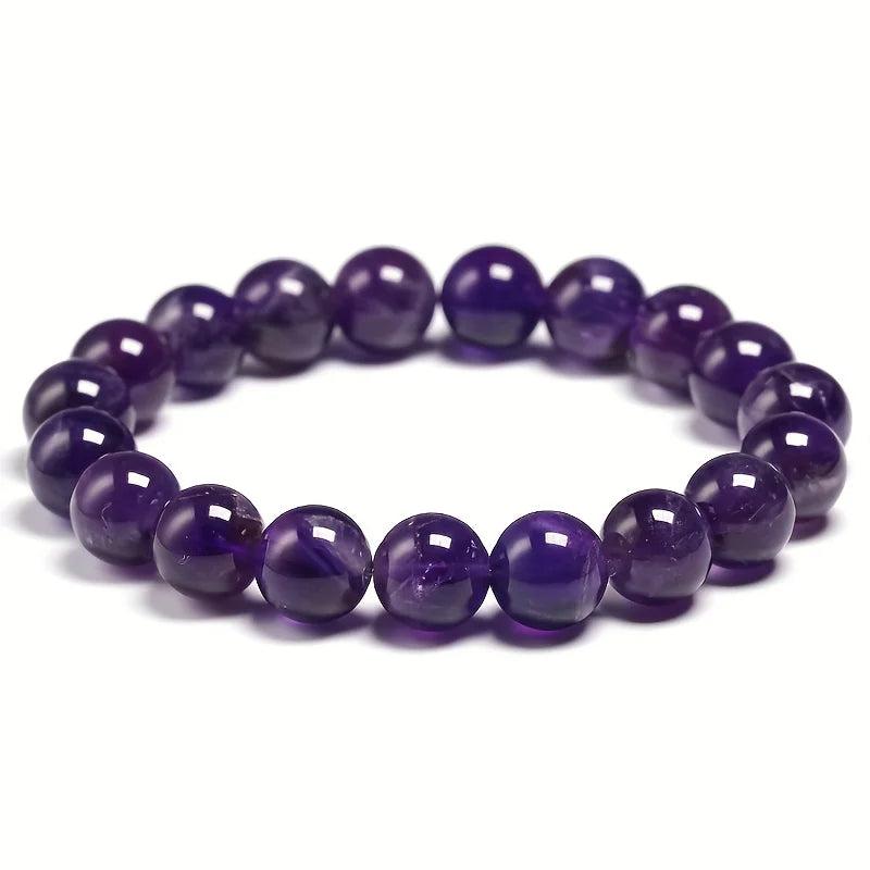 Natural amethyst beaded bracelet with deep violet round beads on an elastic band for peace and tranquility.