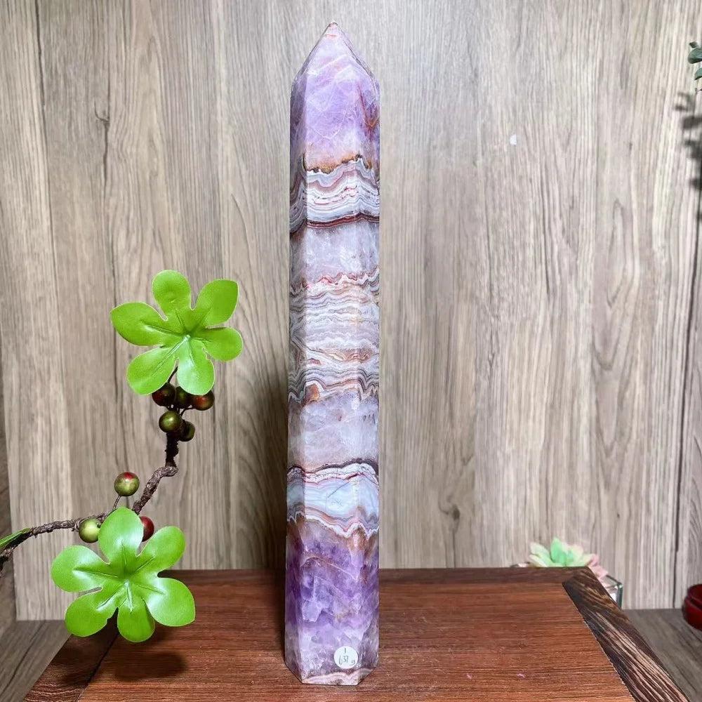 Tall, polished natural amethyst skinny tower with purple, white, and brown bands, ideal for healing and decor.