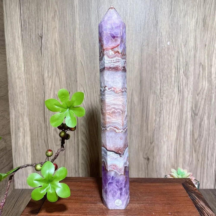 Natural amethyst skinny tower, a tall, faceted purple and white healing crystal reiki energy stone.