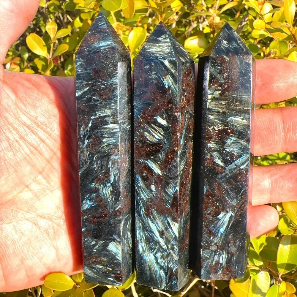 Natural Astrophyllite Tower with Arfvedsonite Flash. Dark matrix, golden-bronze blades, electric blue-green flashes.