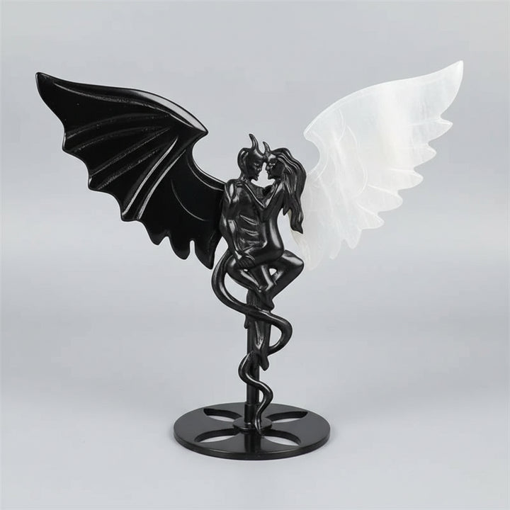 Hand-polished black obsidian and white selenite demon couple statue, a healing crystal ornament for home decor.
