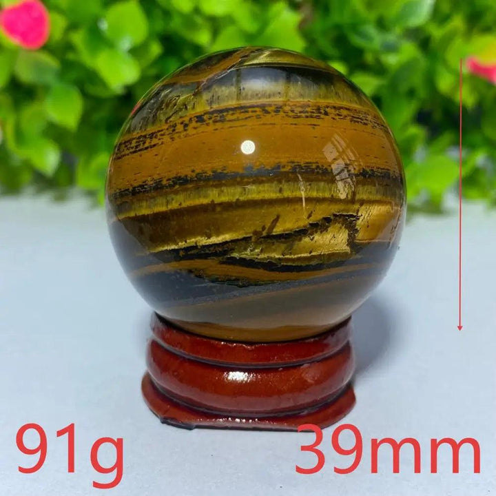 39mm Natural Tiger Eye crystal ball on a wooden stand, perfect for Reiki healing, meditation, and spiritual home decor.
