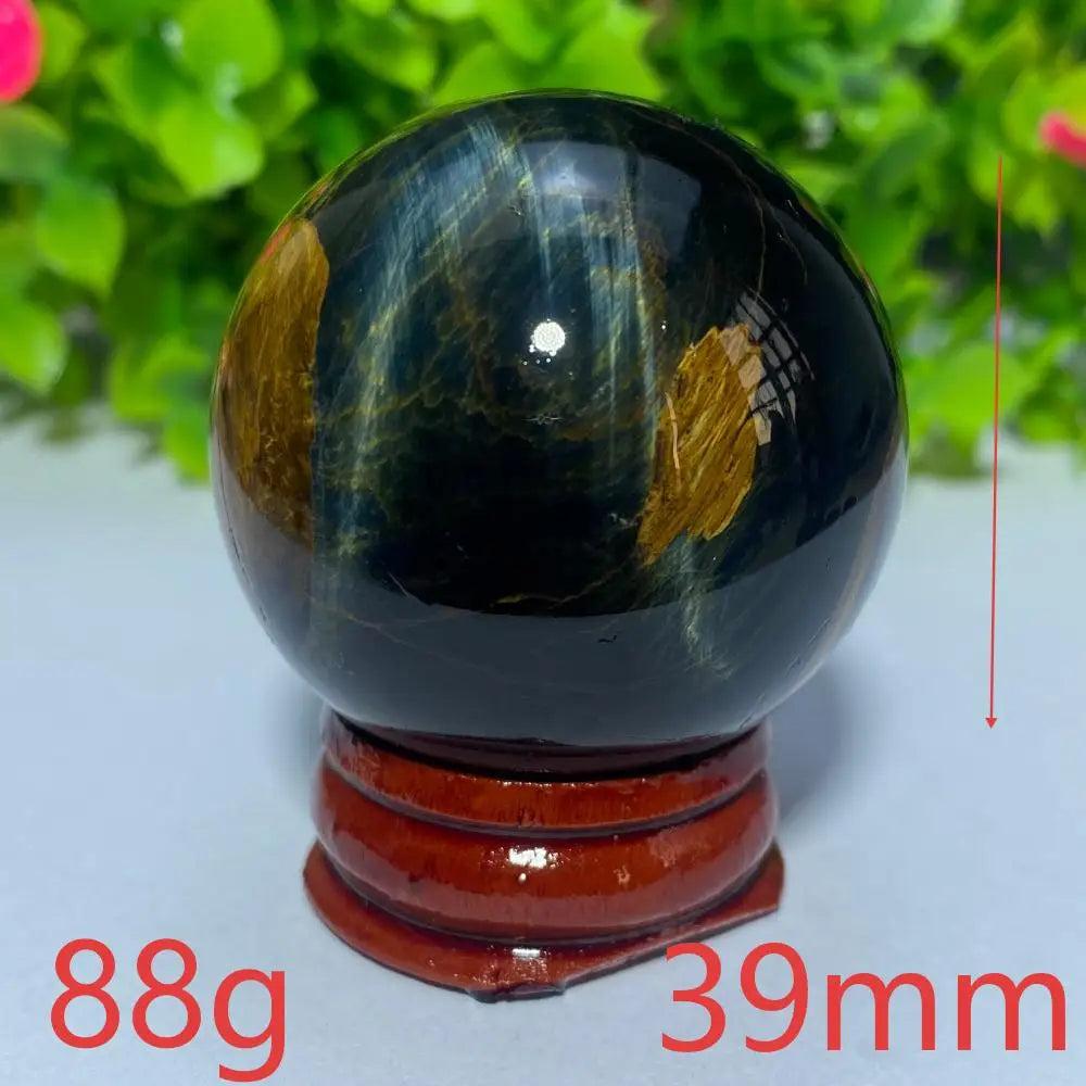 39mm Blue Yellow Tiger Eye crystal ball for Reiki healing and meditation, featuring a polished natural gemstone sphere.