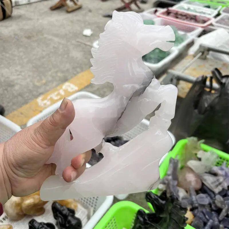 Hand-carved natural calcite jade horse figurine in soft white, promoting heart chakra healing and grounded vitality.