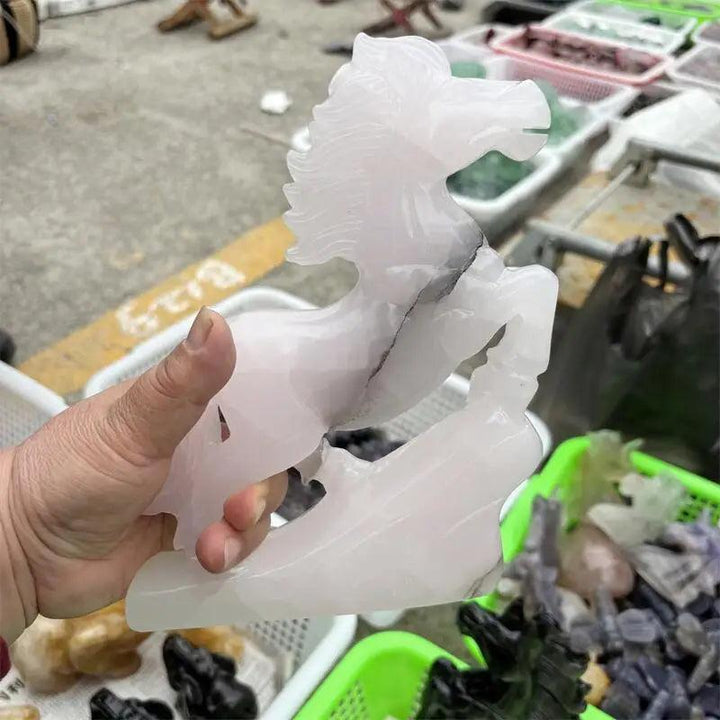 Hand-carved natural calcite jade horse figurine in soft white, promoting heart chakra healing and grounded vitality.