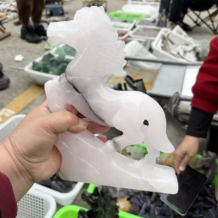 Hand-carved natural calcite jade horse figurine in soft white, promoting heart chakra healing and emotional balance.