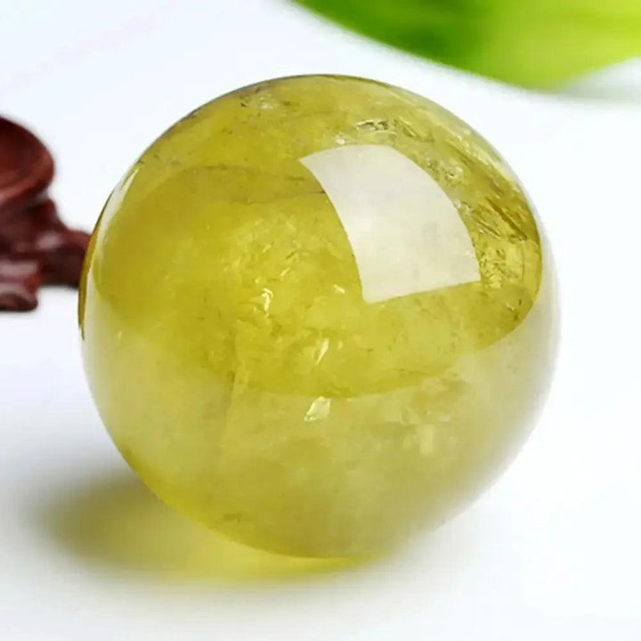 Polished natural Citrine Quartz Sphere from Crystal Destiny, radiating warm golden-yellow hues for abundance and joy.
