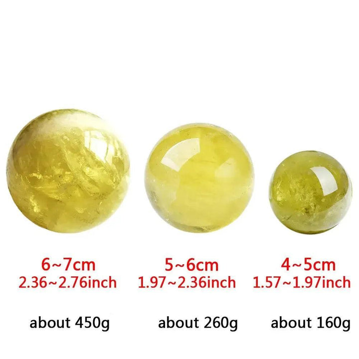 Three polished Natural Citrine Quartz spheres from Crystal Destiny, varying in golden-yellow hues and sizes.