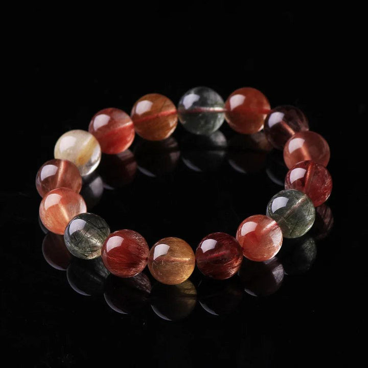 Natural Colorful Rutilated Quartz Beads Bracelet with red, green, copper, and clear round beads.