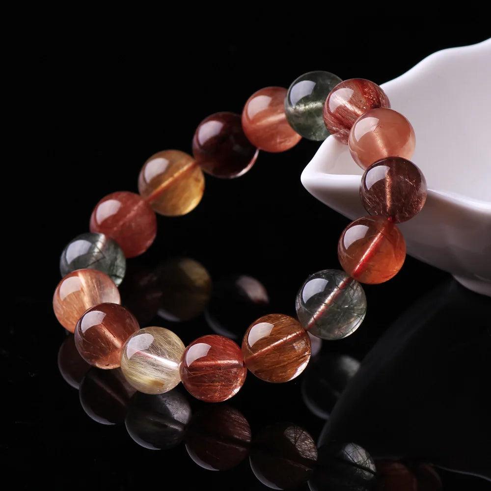 Natural Colorful Rutilated Quartz Beads Bracelet, AAAAA grade, with red, green, copper, and clear round beads.