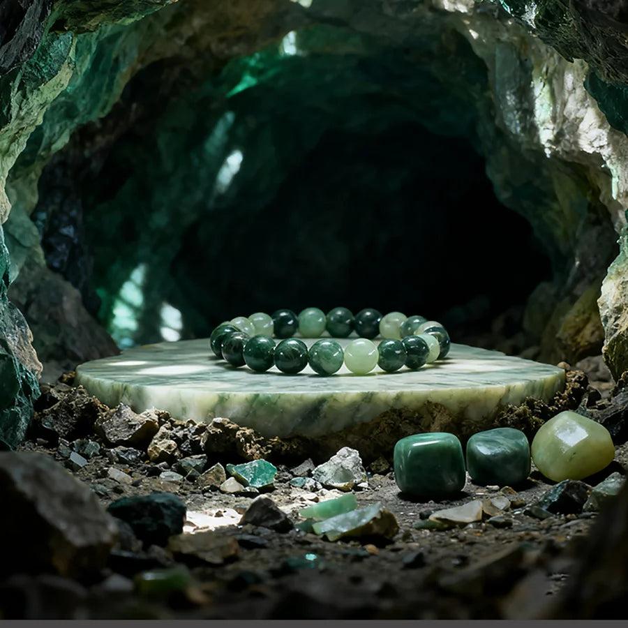 Original Tree Agate Bracelet with natural green stone beads, promoting healing and spiritual balance, displayed in a mystical cave.