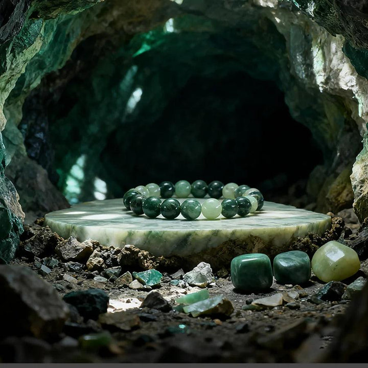 Original Tree Agate Bracelet with natural green stone beads, promoting healing and spiritual balance, displayed in a mystical cave.