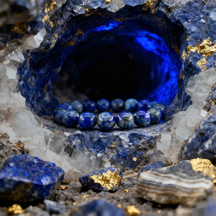 Original Tree Agate Bracelet with natural blue stone beads, nestled in a crystal geode with gold accents and blue light.