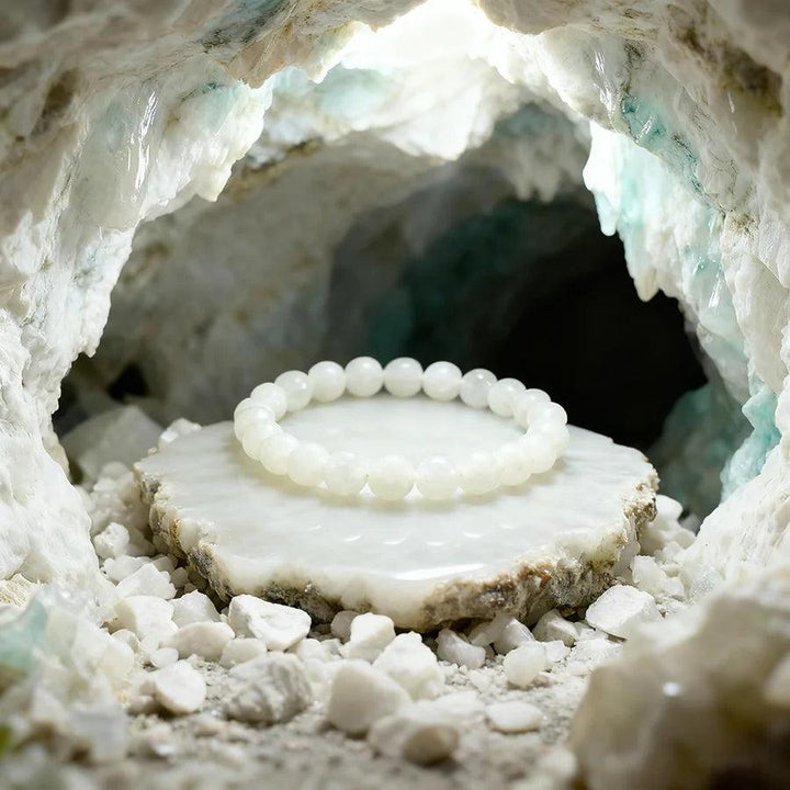 Original Tree Agate Bracelet: Natural white stone beads for healing, spiritual yoga, and meditation, displayed in a crystal cave.