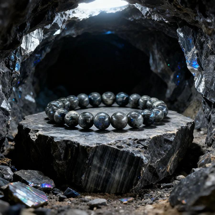 Original Tree Agate Bracelet with natural stone beads, promoting healing and spiritual balance, displayed on a dark rock.