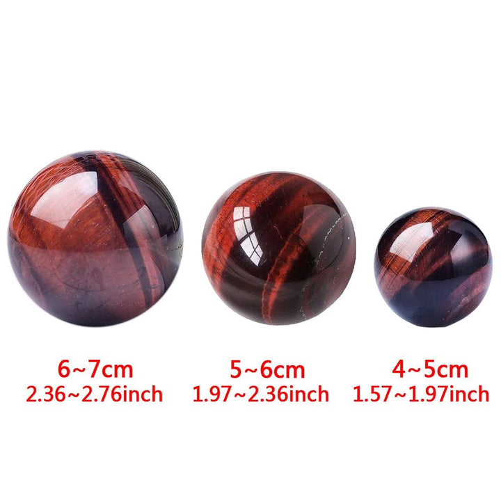 Polished Red Tiger Eye crystal balls in three sizes for Reiki healing, divination, and elegant home decor.