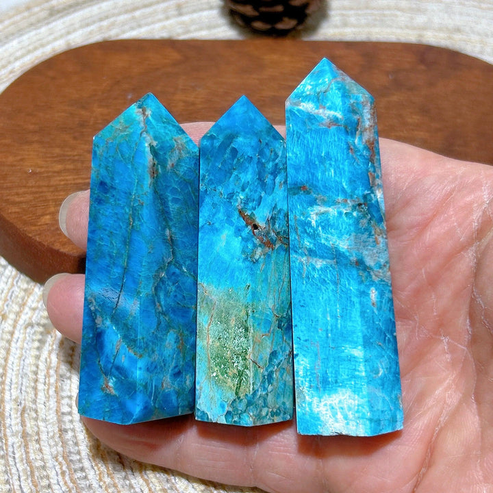 Three vibrant blue flashy Apatite crystal towers with natural mineral veins, perfect for Reiki healing and home decor.