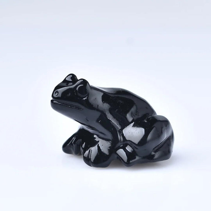 Glossy black Obsidian Natural Crystal Carved Frog Figurine, symbolizing protection and transformation.