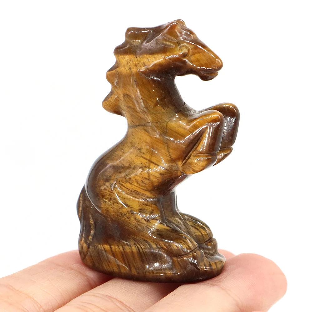 Hand-carved Tiger Eye horse figurine, a grounding crystal statue with golden-brown banding for strength and momentum.