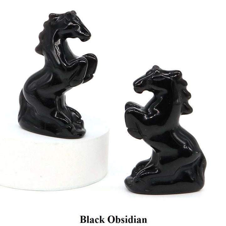 Polished black obsidian horse figurine, a hand-carved crystal statue for grounding energy and spirited home decor.