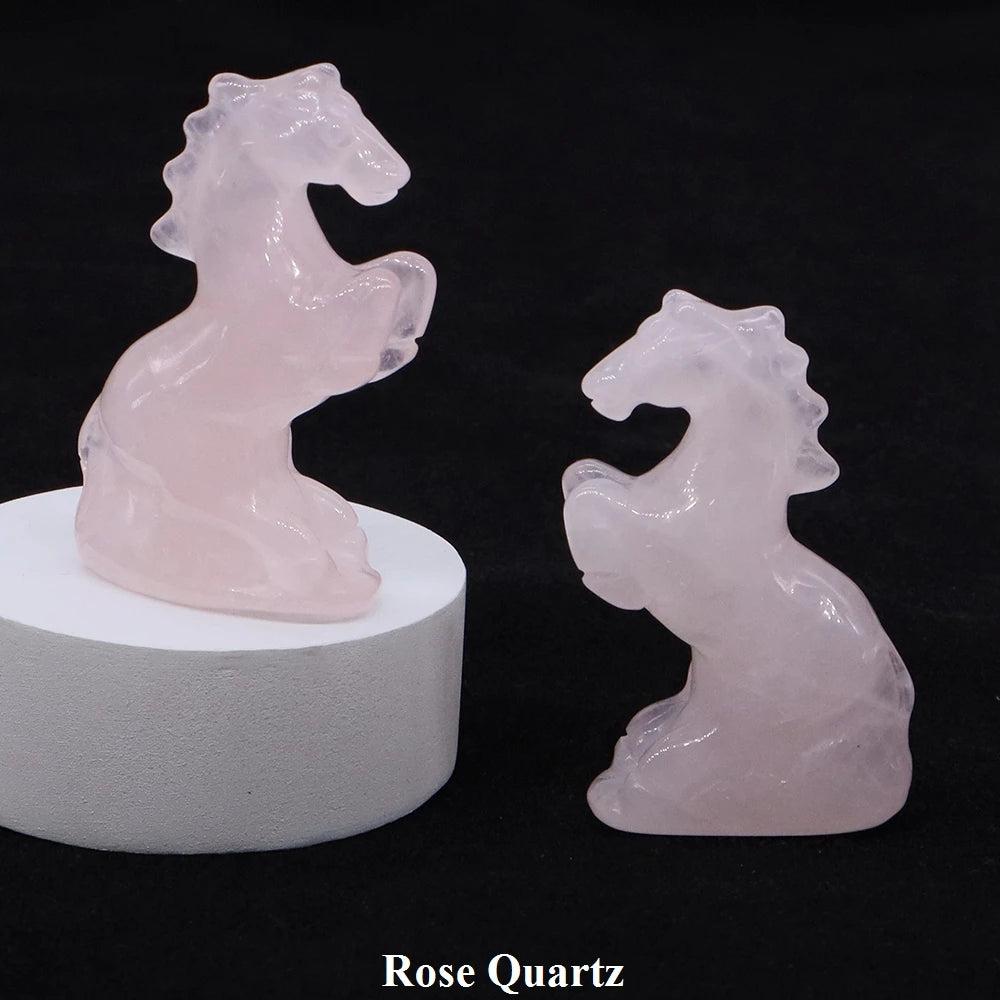 Hand-carved Rose Quartz horse figurine for heart chakra healing, featuring a polished, soft pink crystal design.