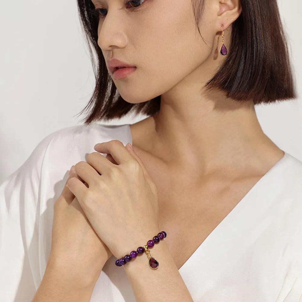 Amethyst crystal jewelry set featuring a stretch bead bracelet and matching drop earrings for Third Eye chakra balance.