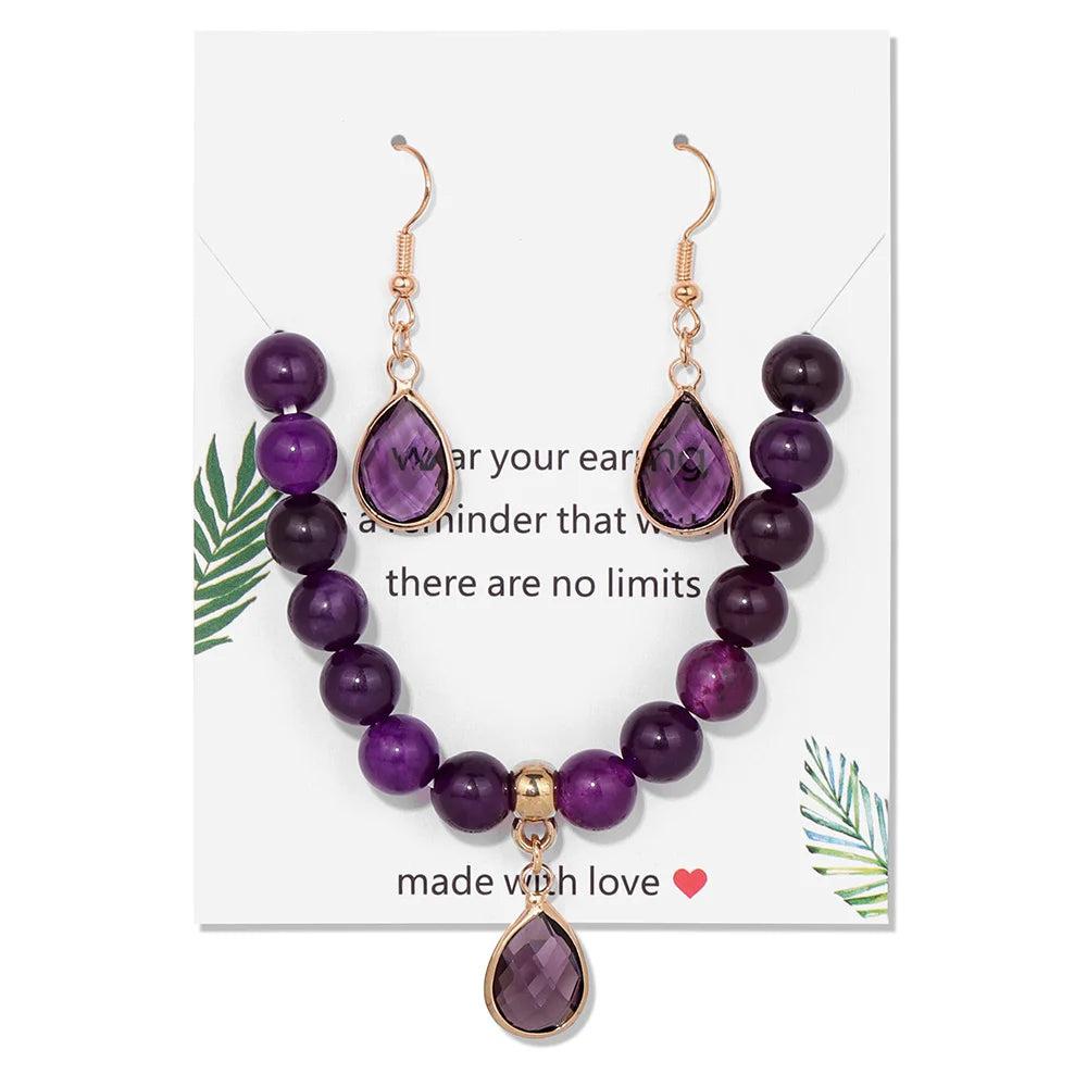 Amethyst crystal jewelry set featuring a beaded stretch bracelet and matching drop earrings for crown chakra healing.