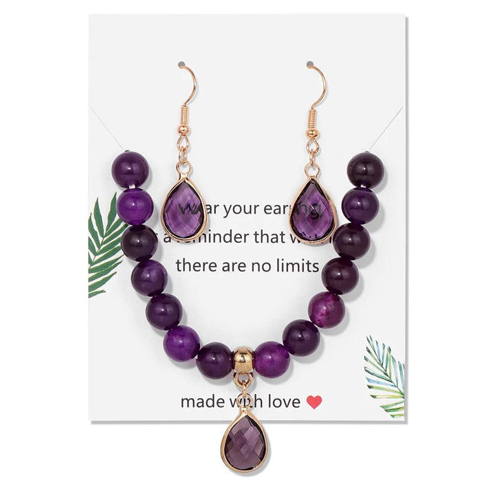 Amethyst crystal jewelry set featuring a beaded stretch bracelet and matching drop earrings for crown chakra healing.