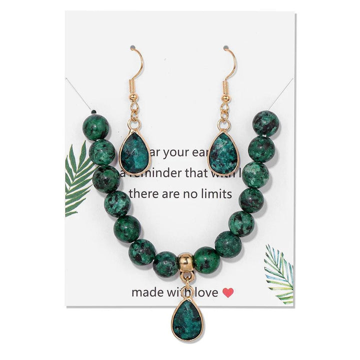Green Granite crystal jewelry set featuring 8mm beaded stretch bracelet and matching water drop stone charm earrings.