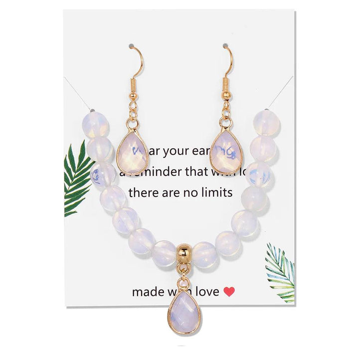 Opal crystal jewelry set featuring an 8mm beaded stretch bracelet and matching water drop earrings for healing energy.
