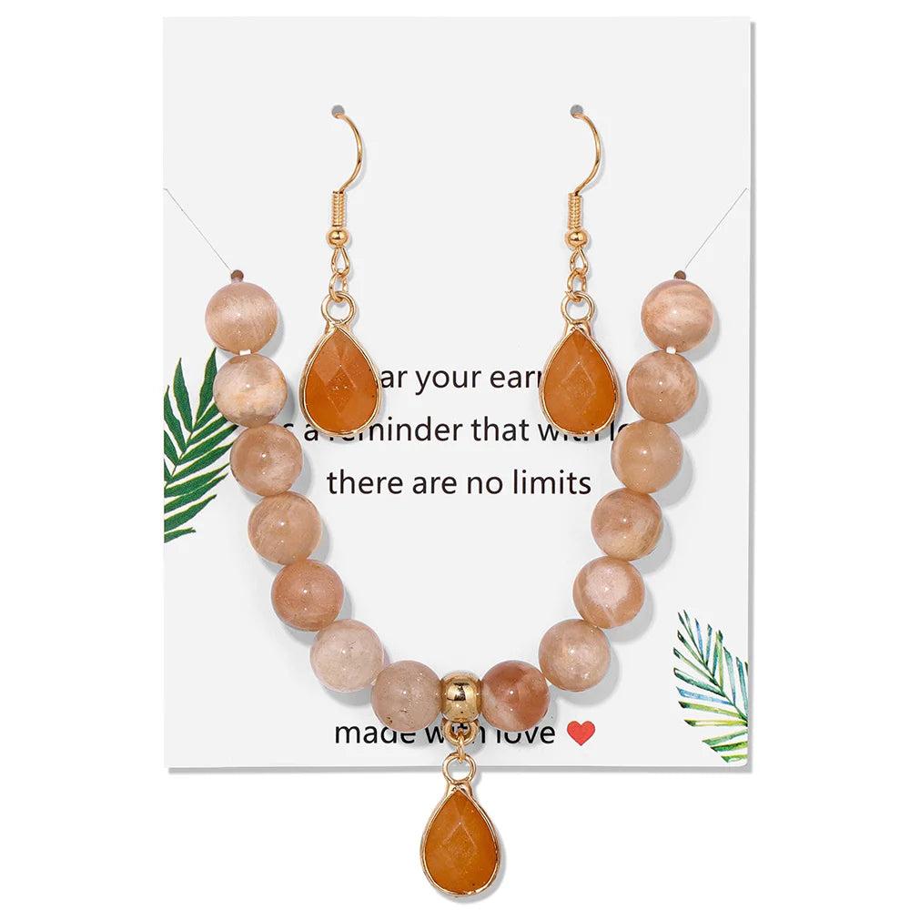 Sunstone crystal jewelry set featuring a beaded stretch bracelet and matching drop earrings for vibrant energy.