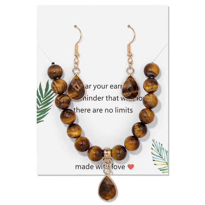 Tiger's Eye crystal jewelry set featuring an 8mm beaded stretch bracelet and matching teardrop earrings for solar plexus.