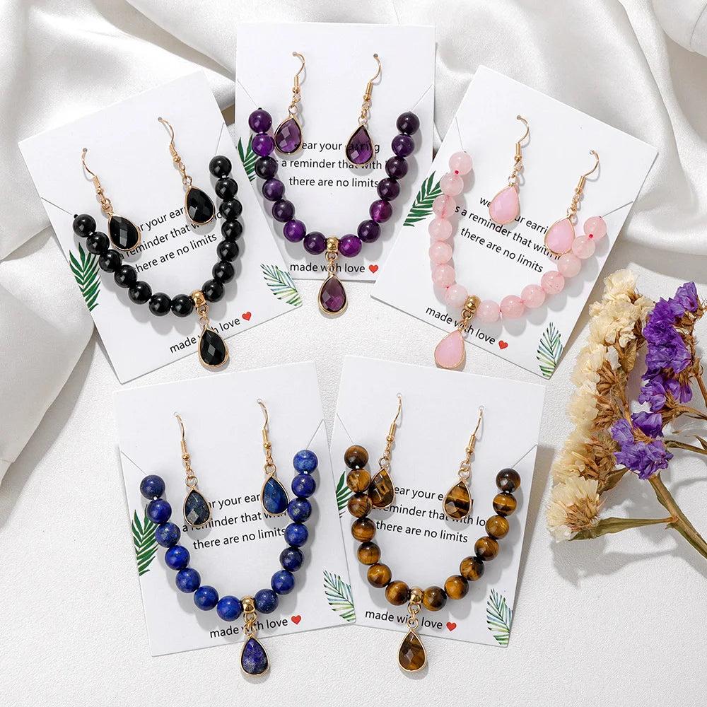 Natural crystal jewelry sets featuring beaded stretch bracelets and matching drop earrings in five vibrant stone varieties.