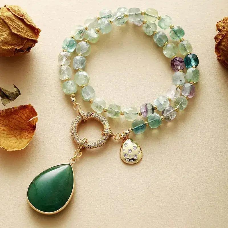 Natural Crystals Pendant Necklaces: Green aventurine teardrop pendant with a gold clasp and beaded fluorite bracelet.