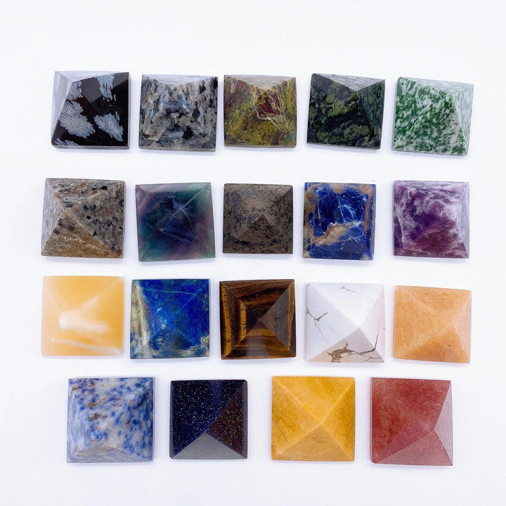 Collection of 20 natural crystal pyramid healing stones, including Tiger Eye, Fluorite, and Lapis Lazuli.