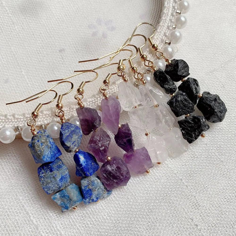 Natural Crystal Earrings: Irregular raw Lapis, Amethyst, Clear Quartz, and Black Tourmaline dangle earrings with gold-tone hooks.