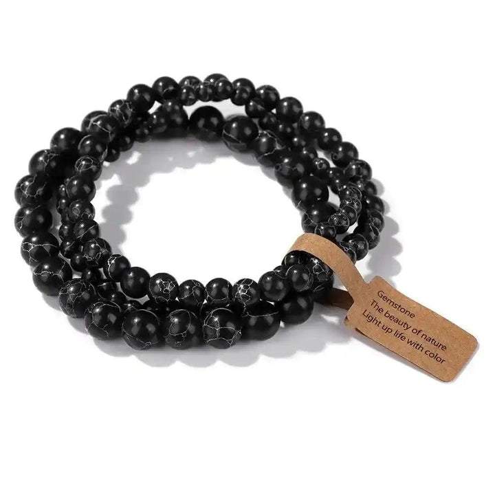 3-Piece Natural Stone Beaded Bracelet Set with black Indian agate for grounding and balance, featuring a blessing tag.
