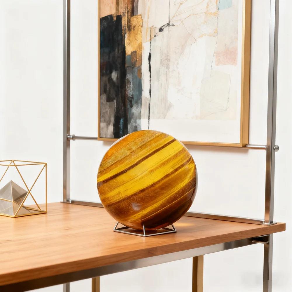 Polished Tiger Eye crystal sphere with golden-brown bands, perfect for Reiki healing and elegant home decor display.
