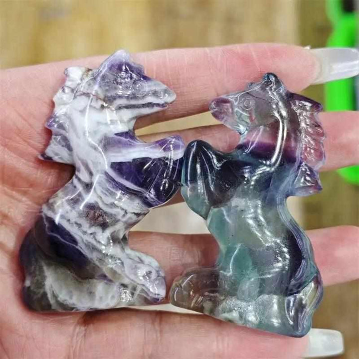 Hand-carved natural quartz horse figurines featuring vibrant purple and green crystal patterns for healing and home decor.