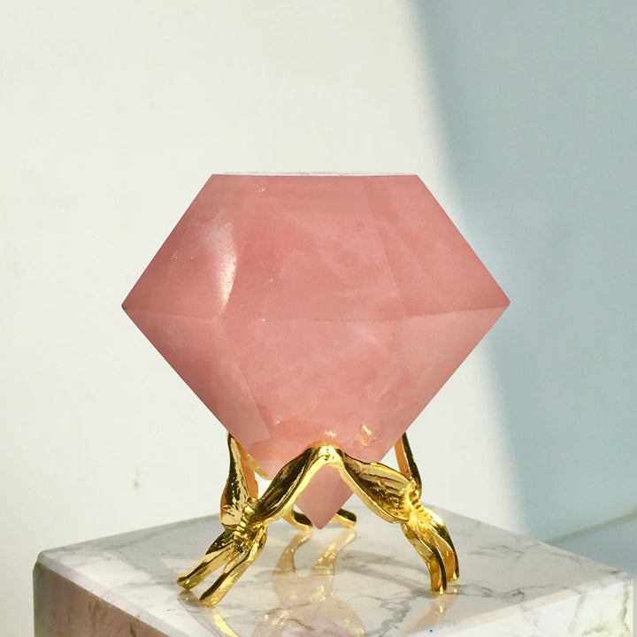 Natural Rose Quartz diamond-shape healing gemstone, 4.5-5cm, on a golden stand, perfect for home decoration.