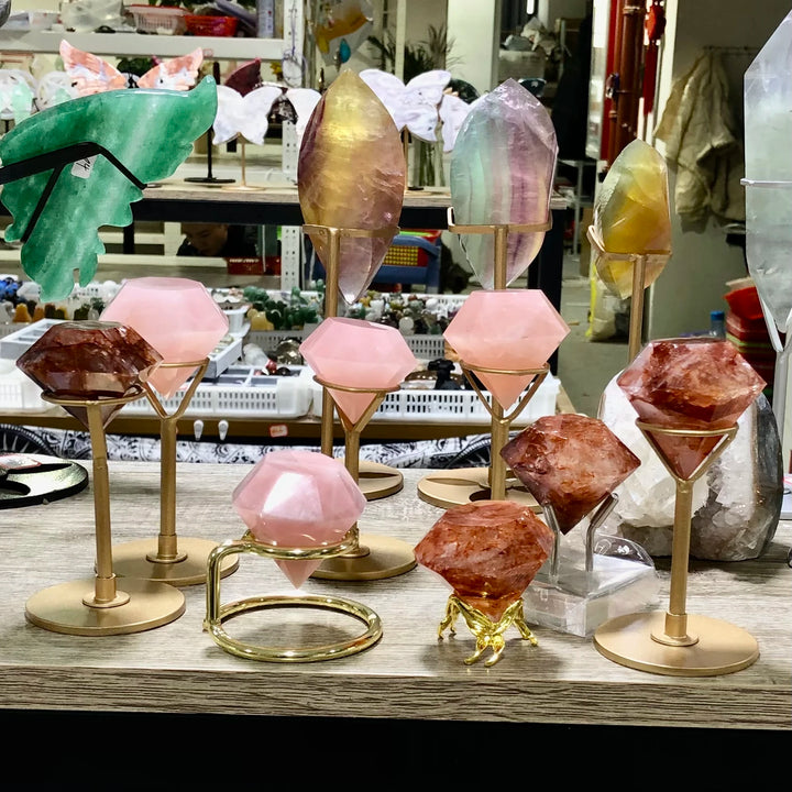 Natural Fire Quartz & Rose Quartz diamond-shaped healing gemstones, 4.5-5cm, on elegant gold stands for home decor.