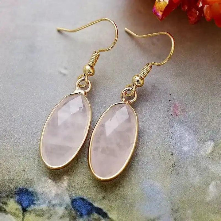 Elegant Rose Quartz Natural Gemstone Dangle Earrings, featuring polished oval pink stones in refined gold-tone drops.