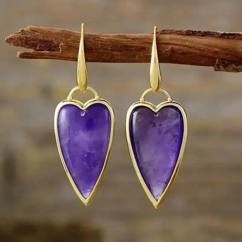 Natural Gemstone Heart Drop Earrings: Elegant purple amethyst hearts in gold settings, promoting balance and positive vibes.