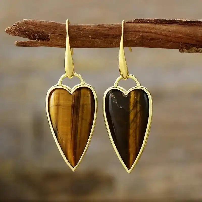 Natural Gemstone Heart Drop Earrings: Tiger's Eye heart-shaped stones in elegant gold drop settings, promoting balance and clarity.