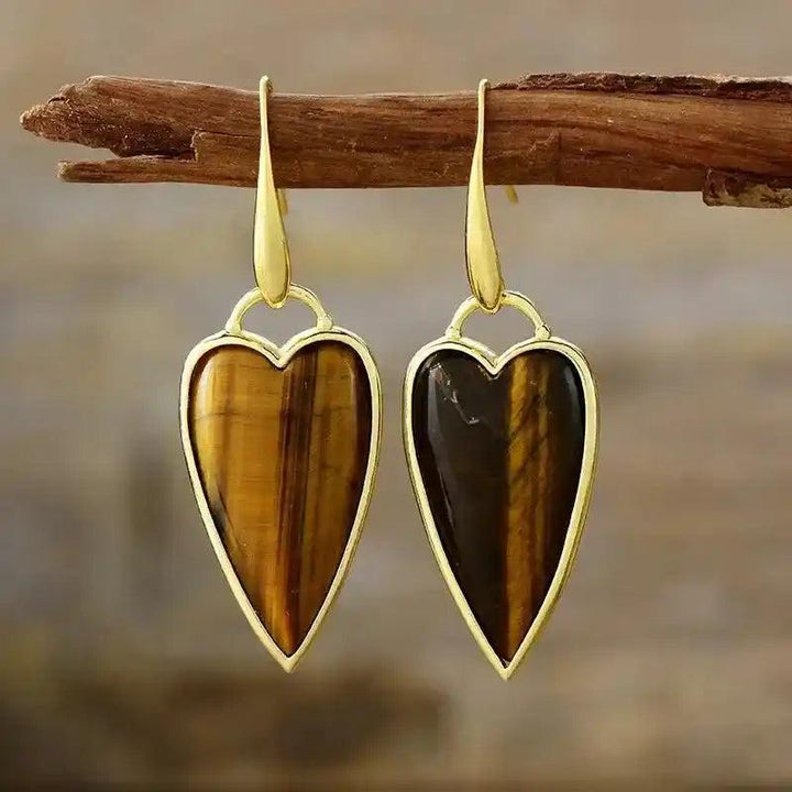 Natural Gemstone Heart Drop Earrings: Tiger's Eye heart-shaped stones in elegant gold drop settings, promoting balance and clarity.
