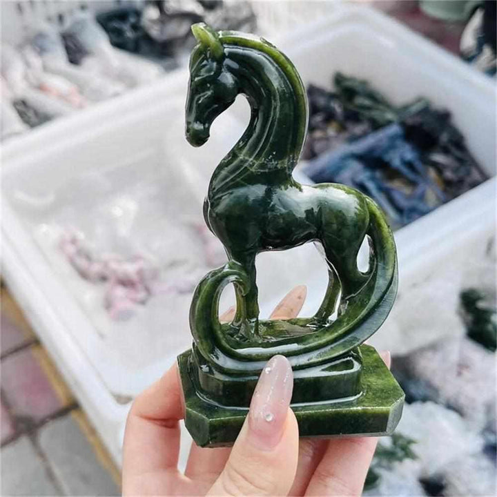Polished green serpentinite horse figurine with deep forest tones, perfect for heart chakra grounding and decor.