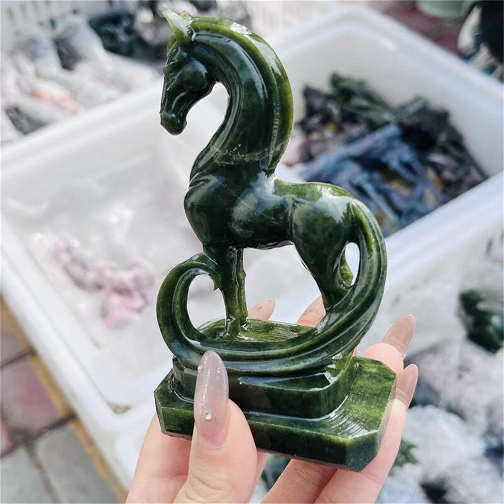 Hand-carved green serpentinite horse figurine featuring deep forest tones and grounding energy for the Heart chakra.