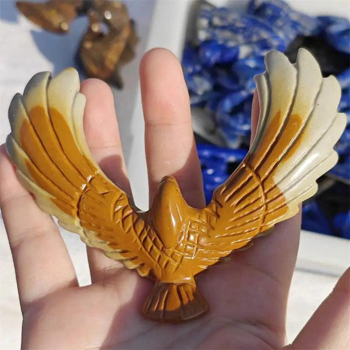 Hand-carved natural jade eagle, a balancing rotating crystal for love healing and Fengshui home decoration.