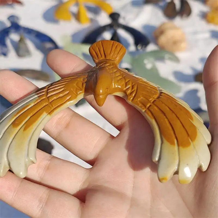 Hand-carved natural jade eagle, a balancing rotating crystal for love, healing, and Fengshui home decoration.